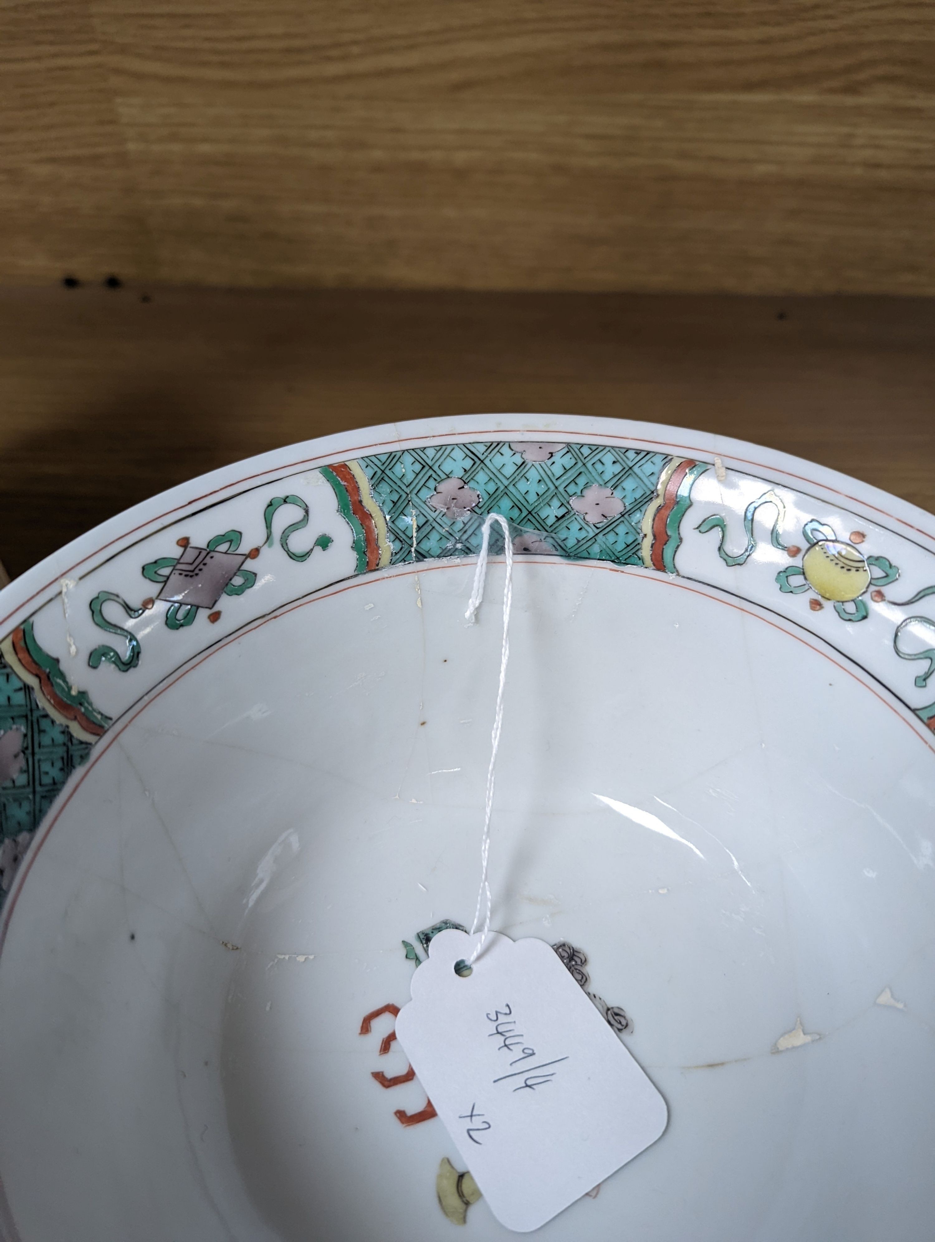 A Kangxi famille verte bowl, 20cm (a.f.) and a Chinese Dowager Empress-pattern pillow with dragons